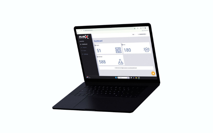 A laptop showcasing the user interface of the Rubix software from i-acs. The dashboard provides a clear overview of active projects, users, and downloads for efficient HVAC system selection.