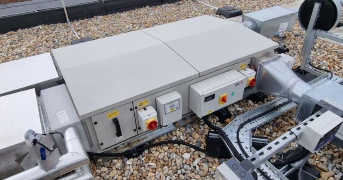 Heat Recovery Unit (HRU) installed by iACS on a rooftop HVAC system, featuring ducting, control panels, and ventilation setup.